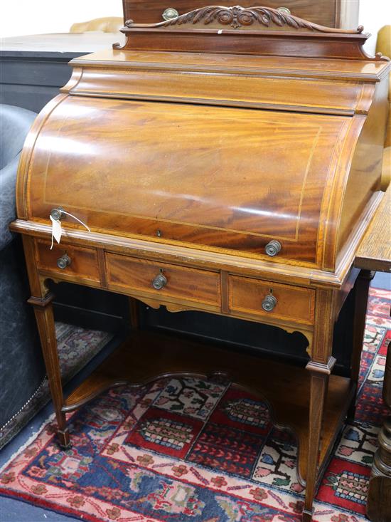 An Edwardian mahogany and tulipwood cylinder front roll top desk W.80cm